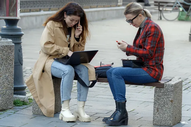 women, working, sitting, bench, street, urban, relaxing, smartphone, laptop, lifestyle. Small business grants reviews: how to compare advisers